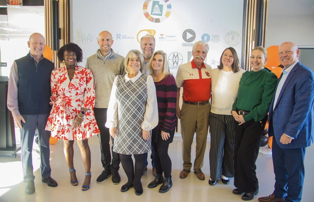 Group photo in front of the event backdrop at GEW Utah 2025