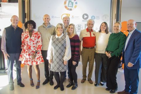 Group photo in front of the event backdrop at GEW Utah 2025